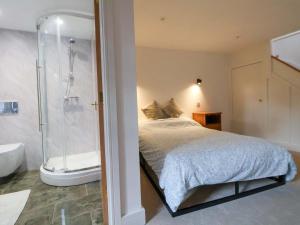 Postel nebo postele na pokoji v ubytování The Apple Store