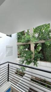 a balcony with a view of a tree outside a window at Dpto Amoblado in Villa María