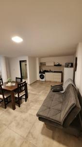 a large living room with a table and a couch at Dpto Amoblado in Villa María