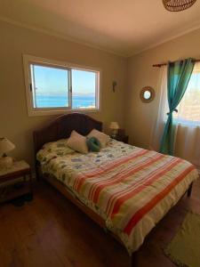 Postel nebo postele na pokoji v ubytování Casa en Tongoy