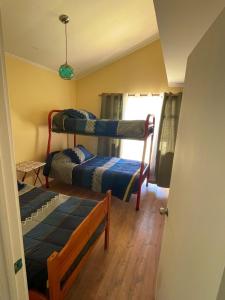 Postel nebo postele na pokoji v ubytování Casa en Tongoy