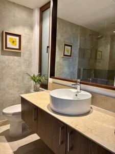 a bathroom with a sink and a toilet at Penthouse Studio 2 blocks from Los Muertos beach in Puerto Vallarta +54 photos