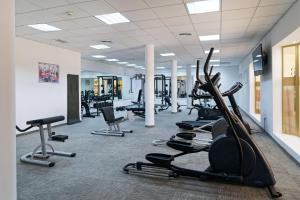 a gym with treadmills and elliptical machines at R2 Lago Playa Park in Cala Ratjada