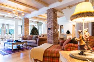a living room with a couch and a table at LeMont Chalet Arachova in Arachova
