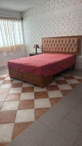 En eller flere senge i et værelse på Casa Colan Frente al Mar