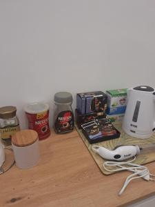 a counter with various food ingredients on it at Apartman LUX Jelena in Surčin +9 photos