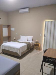 Postel nebo postele na pokoji v ubytování Pousada Sítio Rupestre Peruaçu