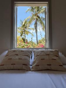 En eller flere senge i et værelse på Pousada Tamuré