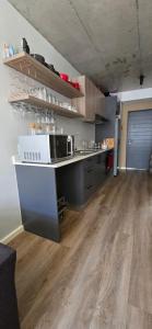 a kitchen with a sink and a counter top at Ebbies place in Cape Town +3 photos