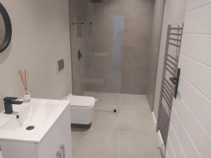 Et badeværelse på Ocean View on Schoongezicht