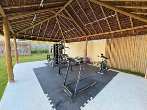 a gym with bikes and exercise equipment in a building at MHV Milagres - Curimã B 1 in Passo de Camarajibe