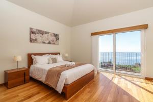 En eller flere senge i et værelse på Rosas House, private house with jacuzzi and BBQ