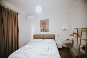 Postel nebo postele na pokoji v ubytování Villa Reve de Tirana