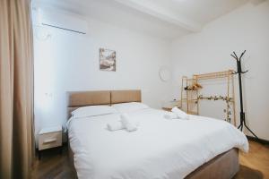 Postel nebo postele na pokoji v ubytování Villa Reve de Tirana