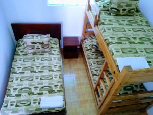 two bunk beds in a room next to each other at Casa de Campo San Cayetano de los vientos in Tibasosa