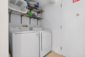 a white laundry room with a washer and dryer at Spacious VIP Penthouse with Ocean & Intracoastal Views, Private Entry, Resort Amenities in Hallandale Beach +60 photos