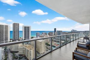 a balcony with a view of the ocean and buildings at Spacious VIP Penthouse with Ocean & Intracoastal Views, Private Entry, Resort Amenities in Hallandale Beach