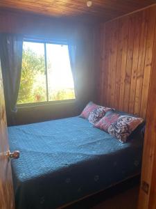 Una cama o camas en una habitación de Cabañas Mimi
