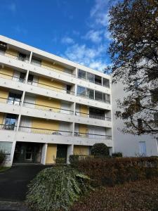 a large white building with a lot of windows at Home in Cenon in Cenon