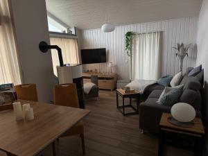 a living room with a couch and a table at Seeschwalbe 78 in Rechlin