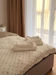 En eller flere senge i et værelse på Forestis Thermalis