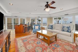 a living room with a couch and a table at Shiphouse 1 - First Floor in East End