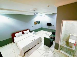 Postel nebo postele na pokoji v ubytování Stadium Haven Hotel + 3 fotografie