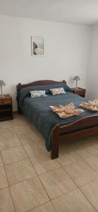 En eller flere senge i et værelse på Eco Apart - Hotel TDF