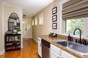 a kitchen with a sink and a window at The Maple Cottage in Asheville