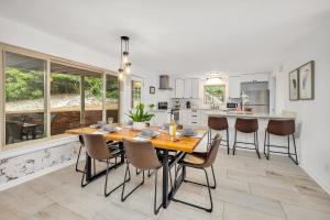a kitchen and dining room with a table and chairs at 8 Stewart Lane in Jekyll Island