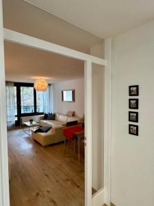 a living room with a couch and a table at Ferienwohnung No 5`2 Rottweil in Rottweil +10 photos