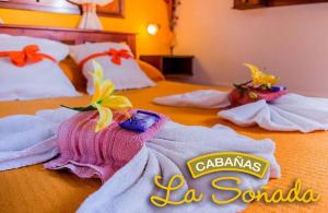 a hotel room with towels on a bed at Cabañas La Soñada in Chajarí