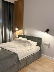 Postel nebo postele na pokoji v ubytování MG Rentals Ks Popiełuszki