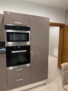 a kitchen with a stainless steel oven in a room at Haus Levi in Imst