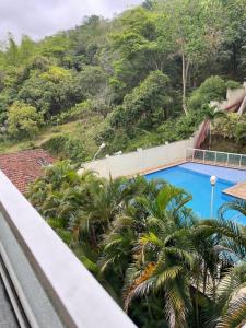 a view of a swimming pool from a balcony at Decoradinho RJ in Rio de Janeiro