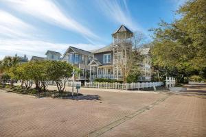 a large house with a tower on top of it at 37 Coast - Ebb Tide Cottage in East End