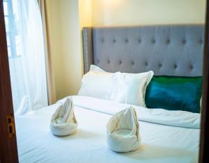 Postel nebo postele na pokoji v ubytování milimaniluxestay