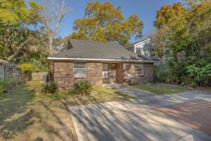 a brick house with a driveway in front of it at 1055 College in Saint Simons Island