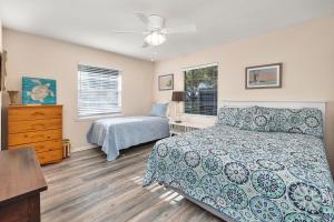 a bedroom with a bed and a dresser at 1055 College in Saint Simons Island