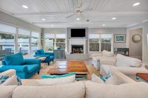 a living room with couches and a fireplace at 1126 Park Lane in Demere Park