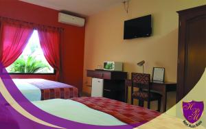 Postel nebo postele na pokoji v ubytování Hotel Plaza Maria