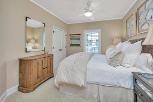 a bedroom with a large bed and a mirror at St. Simons Grand #325 in East End