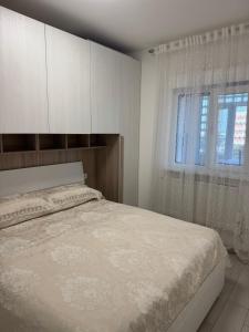 En eller flere senge i et værelse på Appartamento Incantevole 300m dal mare