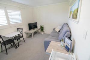 Et tv og/eller underholdning på Melville Views Apartment