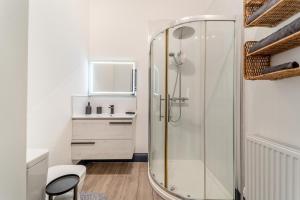 a bathroom with a glass shower with a sink at 5 Bed in Galston oc-s33451 in Galston +36 photos