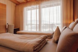 Ένα ή περισσότερα κρεβάτια σε δωμάτιο στο Kronsun Percha