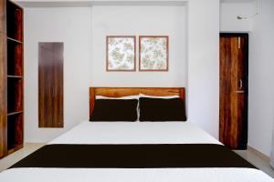 Una cama o camas en una habitación de Hotel O La Vita Oasis