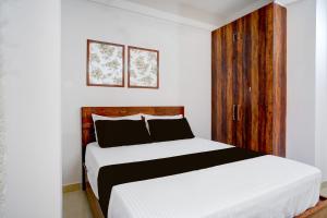 Una cama o camas en una habitación de Hotel O La Vita Oasis