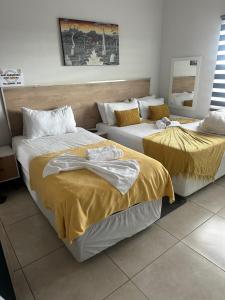 Ένα ή περισσότερα κρεβάτια σε δωμάτιο στο Chirute guest lodge