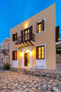 a large white house with windows on a cob at Merry del Mare in Meyisti